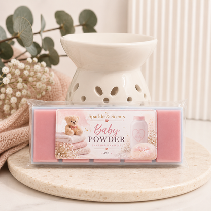 Sparkle & Scents Baby Powder wax melt with a white wax warmer on a decorative surface.
