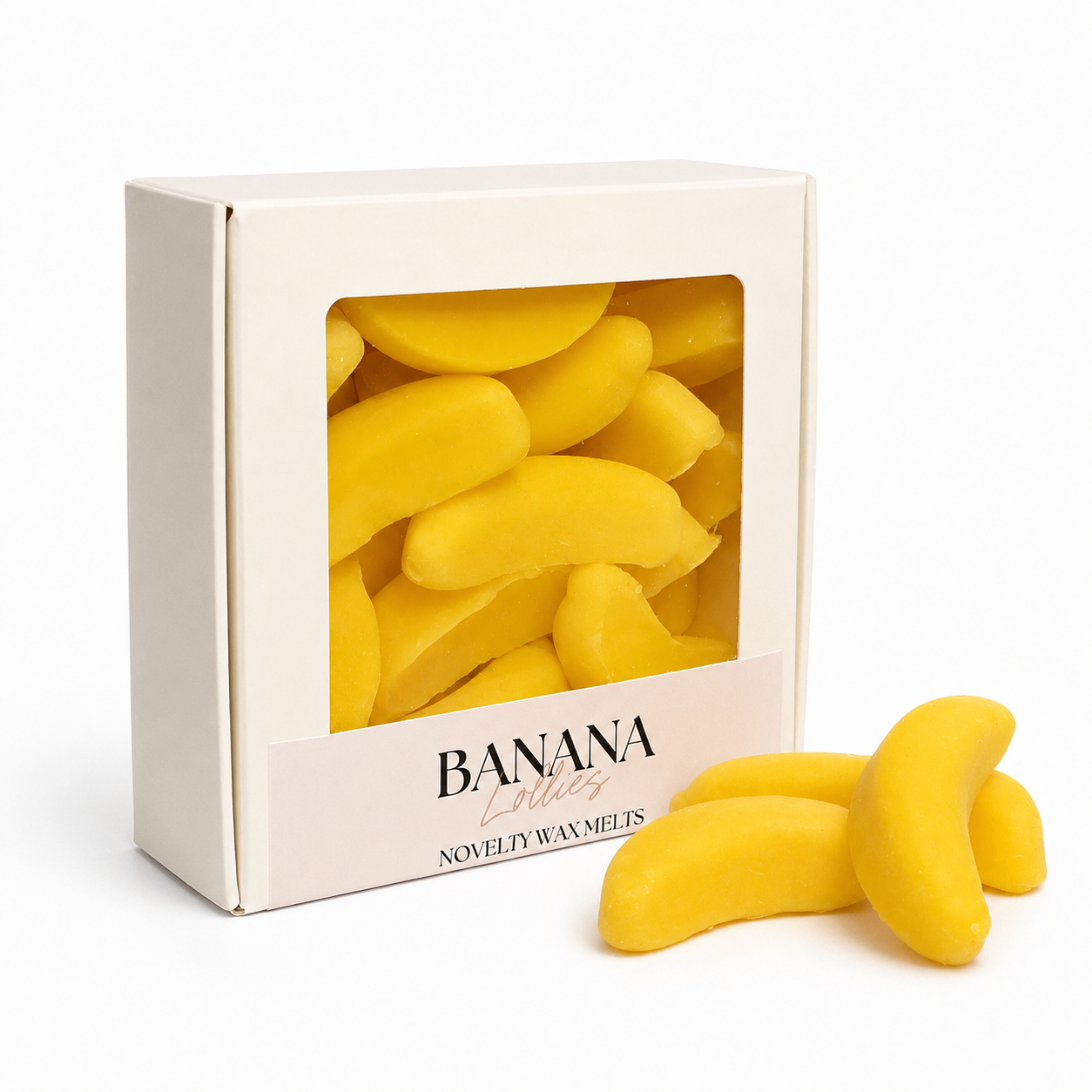 Yellow banana-shaped wax melts in a box labeled 'Banana Lollies'.