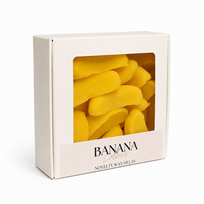 Box of banana-shaped wax melts with 'Banana Lollipops' text on a white background