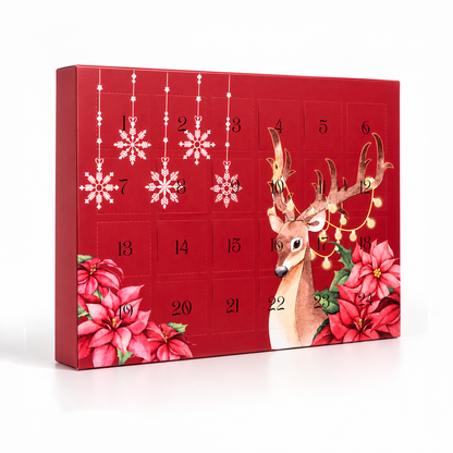 A red Christmas advent calendar box with 24 numbered compartments, decorated with hanging white snowflakes, poinsettias, and a deer illustration with warm string lights on a white background.