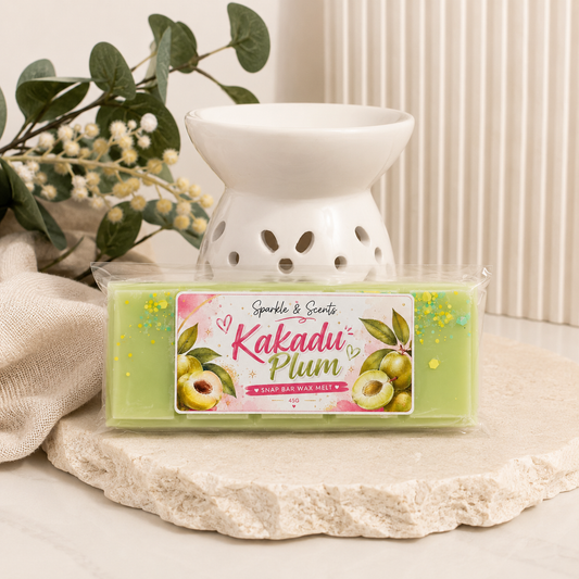 Kakadu Plum wax melt with a white wax warmer on a neutral background